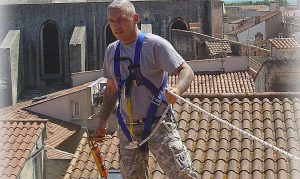 Roofer fixing roof